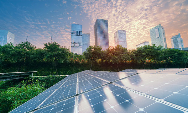 Beautiful view of solar panels in a city with sunset in the background